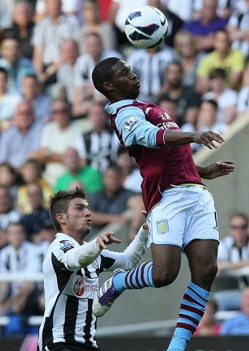 Newcastle&#039;s Davide Santon (L) challenges Aston Villa&#039;s Charles N&#039; Zogbia on September 2, 2012