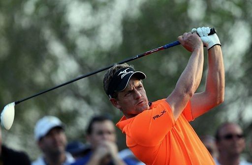 Luke Donald of England watches his shot during the DP World Tour Championship in Dubai on November 24, 2012