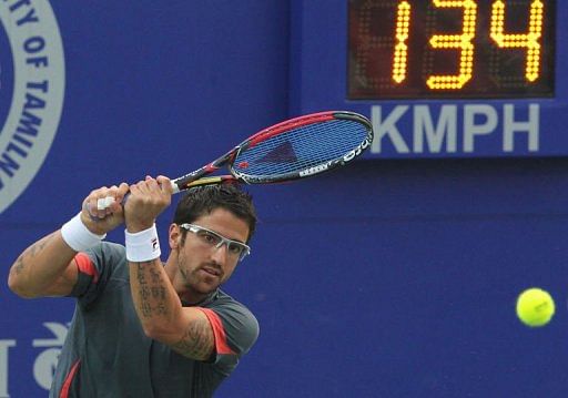 Janko Tipsarevic from Serbia returns a shot at the ATP Chennai Open 2013  in Chennai on January 5, 2013
