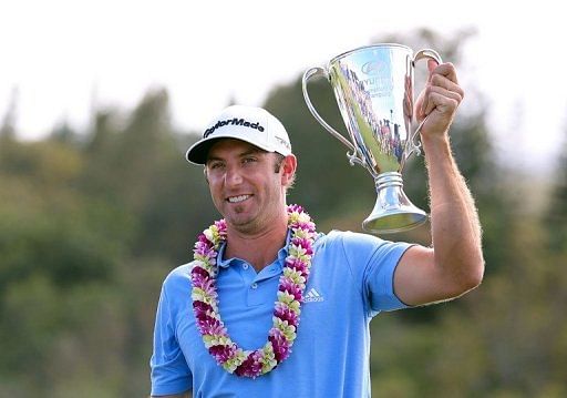 Dustin Johnson celebrates with the Hyundai Tournament of Champions Cup in Kapalua, Hawaii on January 8, 2013