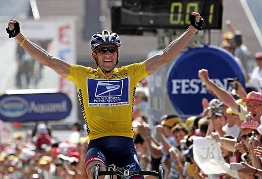 US cyclist Lance Armstrong celebrates as he crosses the finish line and wins the Tour de France on July 22, 2004