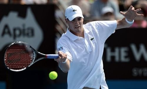 John Isner of the US returns a shot against Ryan Harrison during their Sydney International match on January 9, 2013