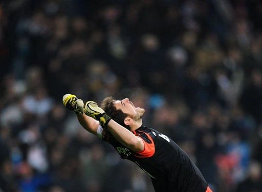 Real Madrid&#039;s goalkeeper and captain Iker Casillas celebrates his team&#039;s score on January 9, 2012