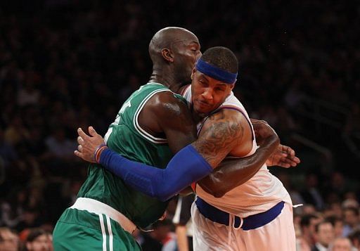Carmelo Anthony (R) and Kevin Garnett get into an altercation on January 7, 2013