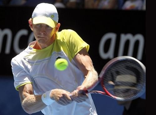 Kevin Anderson hits a return against Jo-Wilfried Tsonga at the Hopman Cup on January 4, 2013