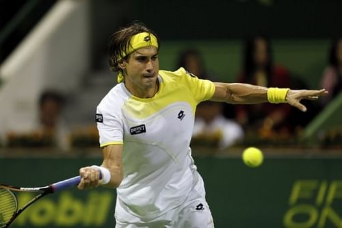 Spain's David Ferrer returns the ball to Russia's Nikolay Davydenko n Doha on January 4, 2013