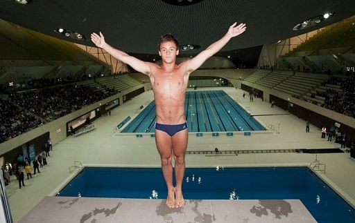 Tom Daley prepares to dive into a new aquatic centre pool in London, on July 27, 2011