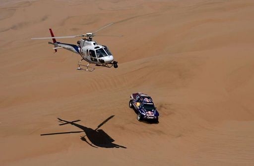 Qatar&#039;s Nasser Al-Attiyah steers his buggy during the Stage 6 of the Dakar Rally on January 10, 2013
