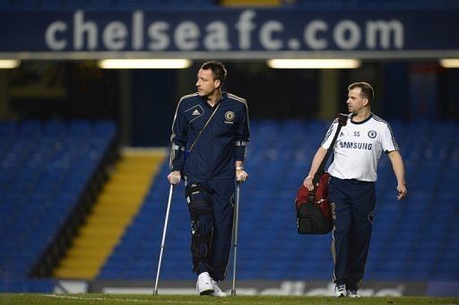 Chelsea&#039;s English defender John Terry walks on crutches on November 11, 2012.