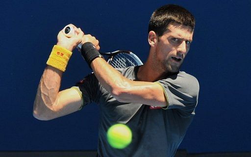 Novak Djokovic hits a return during a practice session for the Australian Open, on January 10, 2013