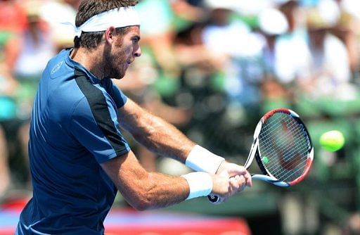 Juan Martin del Potro hits a backhand return during his victory over Marcos Baghdatis on January 11, 2013