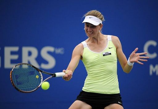 Mona Barthel returns to Agnieska Radwanska of Poland during a Rogers Cup match in Montreal on August 9, 2012