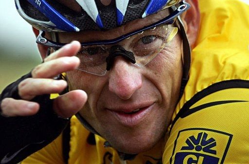 Lance Armstrong cycles during the 91st Tour de France race between Amiens and Chartres on July 8, 2004