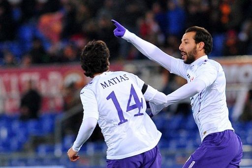 Fiorentina&#039;s Mounir El Hamdaoui celebrates after scoring a goal against AS Roma, on December 8, 2012