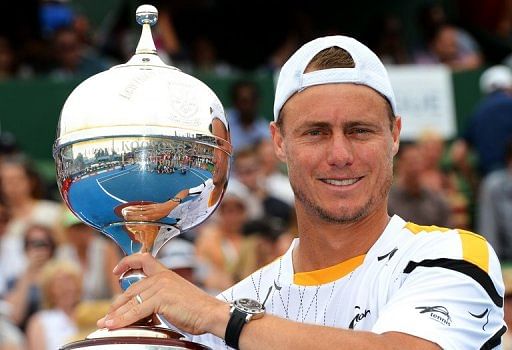 Lleyton Hewitt holds the trophy after defeating Juan Martin Del Potro in the Kooyong Classic final, on January 12, 2013