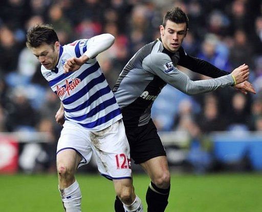 QPR&#039;s Jamie Mackie (L) clashes with Tottenham&#039;s Gareth Bale during their English Premier League match, January 12, 2013