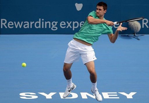 Bernard Tomic of Australia returns a shot during a match at ATP Sydney International, on January 9, 2013