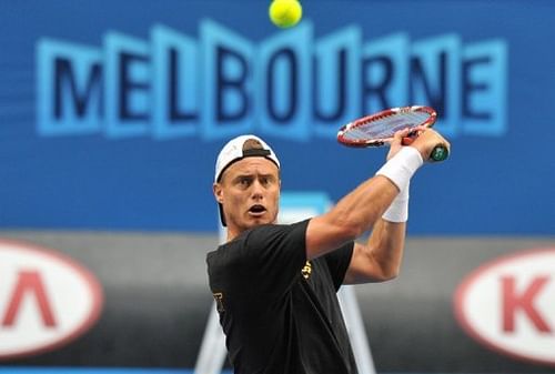 Lleyton Hewitt hits a shot during a training session ahead of the Australian Open in Melbourne on January 13, 2013