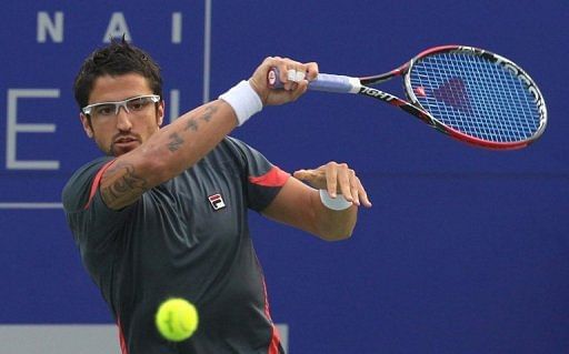 Janko Tipsarevic from Serbia returns a shot an  ATP Chennai Open match in Chennai on January 5, 2013