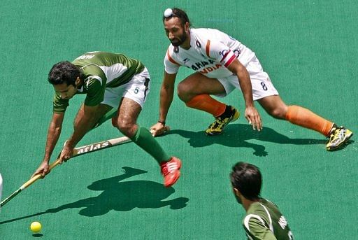 India&#039;s Sardar Singh (R) during an International Super Series hockey match in Perth on November 25, 2012