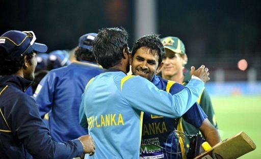 Sri Lanka&#039;s Lahiru Thirimanne (R) celebrates his 100 runs at the Adelaide Oval on January 13, 2013