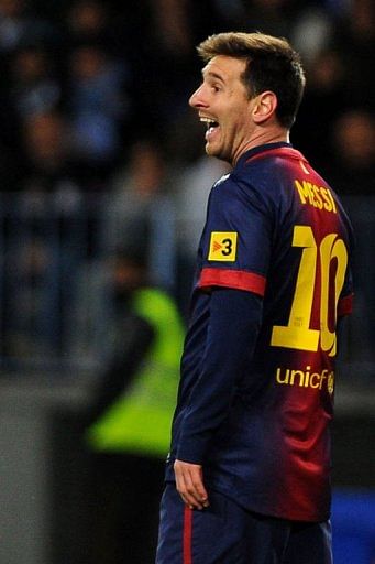 Barcelona&#039;s Lionel Messi smiles on January 13, 2013 at Rosaleda stadium in Malaga