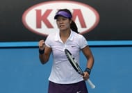 Li Na wins a point against Sesil Karatantcheva during their first-round match at the Australian Open on January 14, 2013