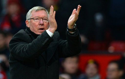 Manchester United manager Alex Ferguson applauds after seeing his side beat Liverpool 2-1 on January 13, 2013