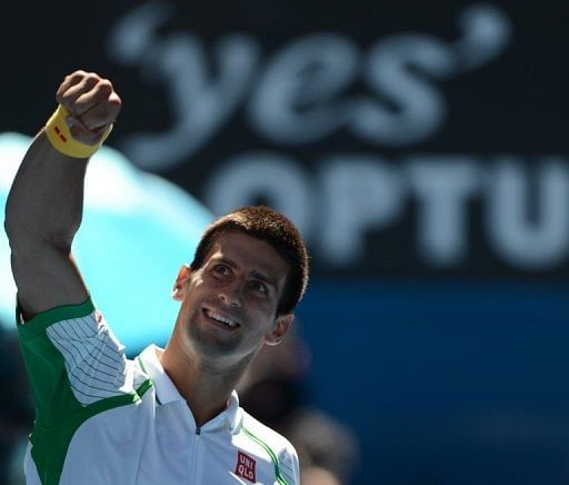 Novak Djokovic celebrates victory against Paul-Henri Mathieu at the Australian Open on January 14, 2013