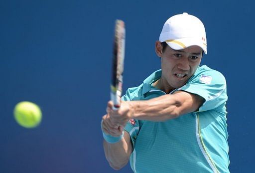 Kei Nishikori plays a stroke in his first-round win at the Australian Open in Melbourne on January 14, 2013