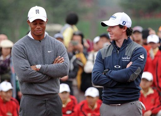 Tiger Woods (left) chats with Rory McIlroy ahead of a one-day golf challenge in Zhengzhou on October 29, 2012