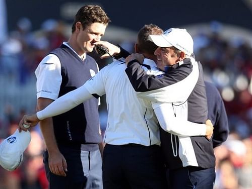 Sergio Garcia, Justin Rose and Paul McGinley of Europe celebrate at the Ryder Cup at Medinah on September 30, 2012