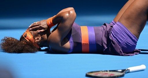 Serena Williams lies on the court in pain during her first-round match at the Australian Open on January 15, 2013