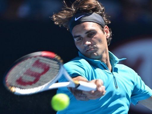 Roger Federer plays a return during his match against Benoit Paire at the Australian Open on January 15, 2013