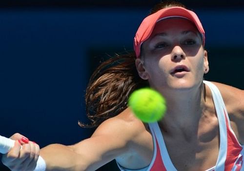 Agnieszka Radwanska plays a return during her match against Irina-Camelia Begu at the Australian Open on January 16, 2013