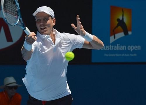 Tomas Berdych plays a return during his match against Guillaume Rufin at the Australian Open on January 16, 2013