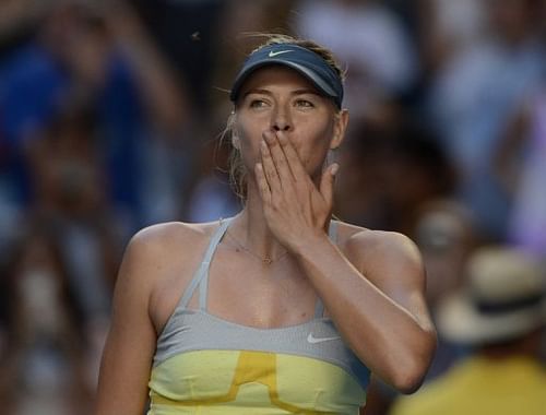 Maria Sharapova blows a kiss to the crowd as she celebrates victory over Misaki Doi on January 16, 2013