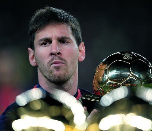 Barcelona&#039;s Lionel Messi holds his 4th FIFA Ballon d&#039;Or trophy prior to the match in Barcelona on January 16, 2013