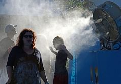 Spectators urged to take cover as Open sizzles