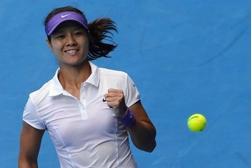 China's Li Na celebrates after beating Romania's Sorana Cirstea during their Australian Open match on January 18, 2013