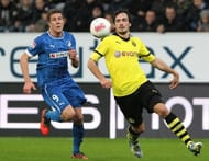 Hoffenheim's Sven Schipplock (L) and Dortmund's Mats Hummels fight for the ball, in Sinsheim, on December 16, 2012