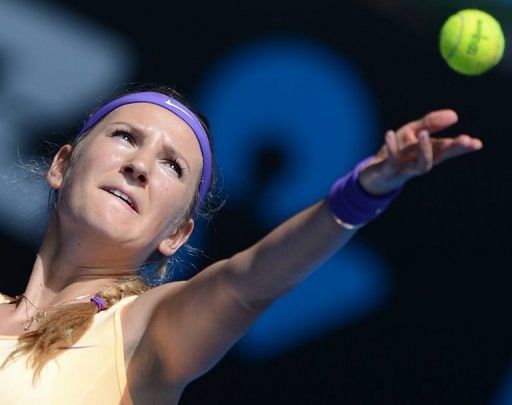 Victoria Azarenka serves against Jamie Hampton, in Melbourne, on January 19, 2013