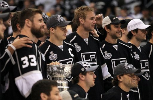 The L. A. Kings&#039; players are seen with their Stanley Cup, in Los Angeles, on June 14, 2012