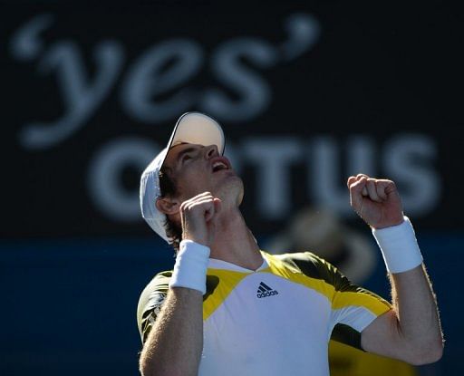 Andy Murray celebrates after winning his match against Ricardas Berankis, in Melbourne, on January 19, 2013