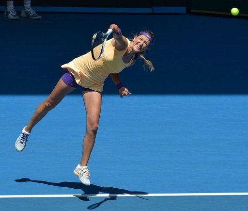 Victoria Azarenka serves against Jamie Hampton, in Melbourne, on January 19, 2013