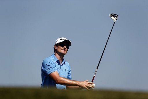 Justin Rose plays a shot in the Abu Dhabi Golf Championship on January 19, 2013