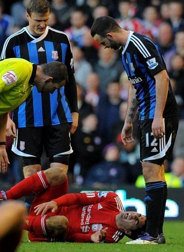 Luis Suarez lies on the ground during Liverpool&#039;s FA Cup quarter final against Stoke at Anfield on March 18, 2012
