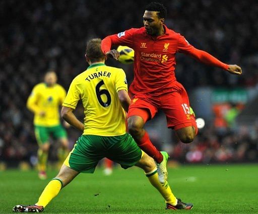 Liverpool&#039;s Daniel Sturridge (R) is tackled by Norwich City&#039;s Michael Turner in Liverpool on January 19, 2013