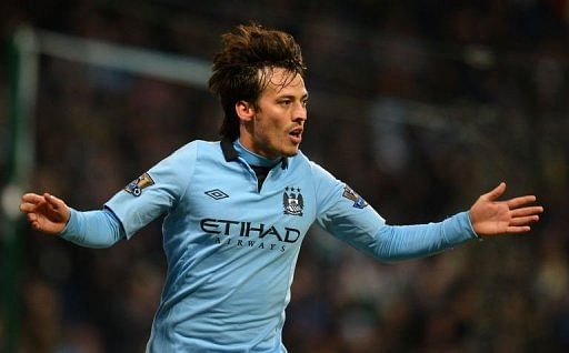Manchester City&#039;s midfielder David Silva celebrates after scoring in Manchester on January 19, 2013