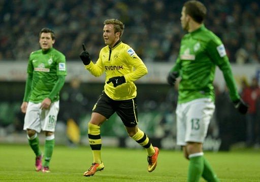 Dortmund&#039;s Mario Goetze (C) celebrates scoring in Bremen on January 19, 2013
